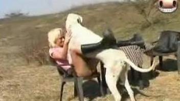 Outdoor fucking scene featuring a blond-haired zoo slut