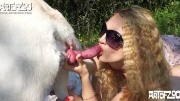 Sexy blonde lady getting screwed by a white dog