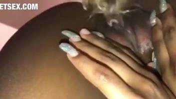 Ebony girl getting fucked by a very avid animal