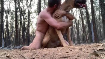 Muscular dude strips naked to flip-flop with a dog